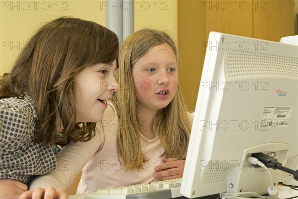 Elementary school girls working in computer room