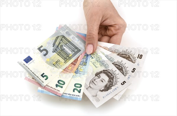 Hand holding money notes