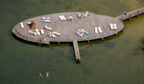 Aerial view of bathing jetty with sunbeds and bathers