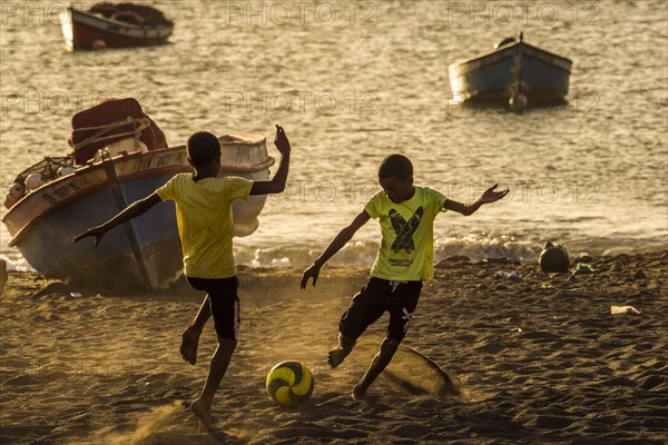 Teenager playing soccer