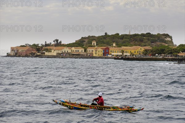 Fishermen in a traditional canoe on the Isle de Goree