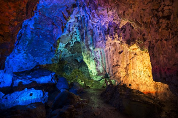 Colorfully illuminated cave