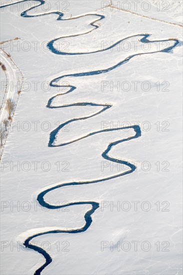 Meandering river Mohne in the snow