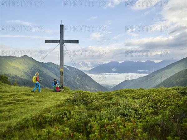 Hikers at summit cross