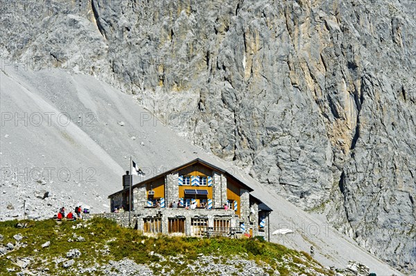 Carschinahutte in front of rock wall of Sulzfluh