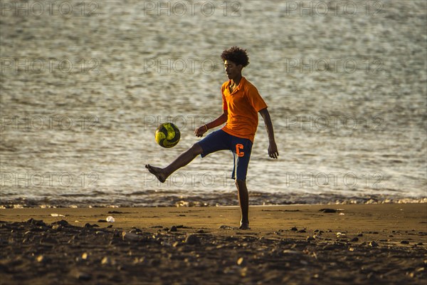Teenager playing soccer