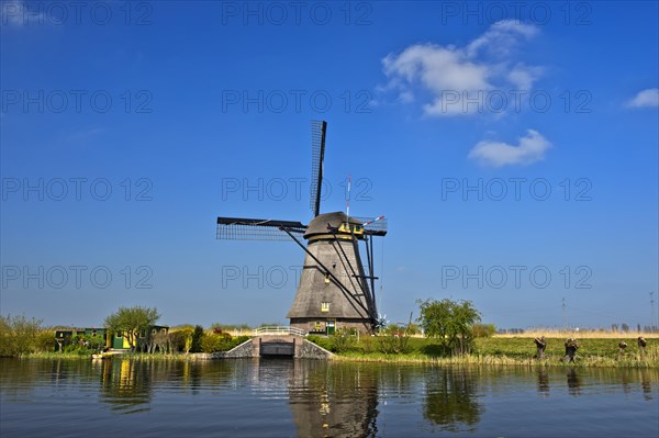 Dutch windmill over a canal