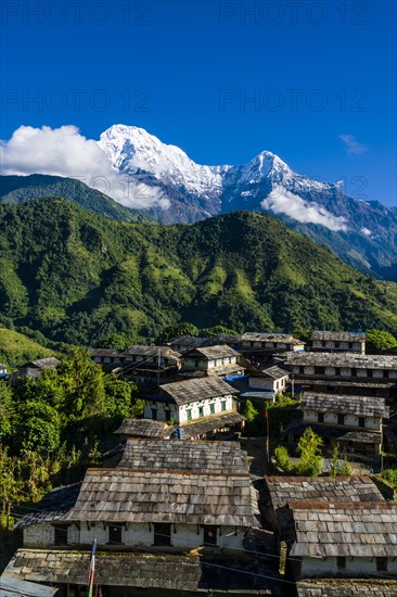 View on the historical village with the mountains Annapurna South
