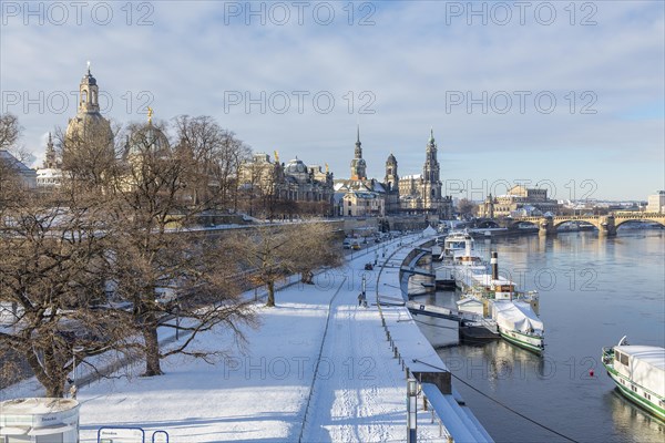 Snowy historic centre with Elbe and pier for steamboats