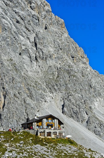 Carschinahutte in front of rock wall of Sulzfluh