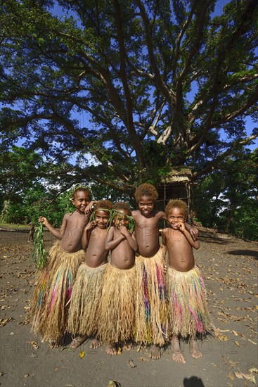Native children with bast skirts