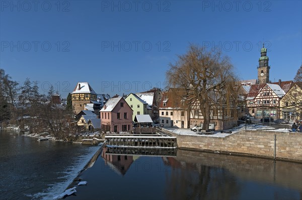 City scape with river and old grinding mill