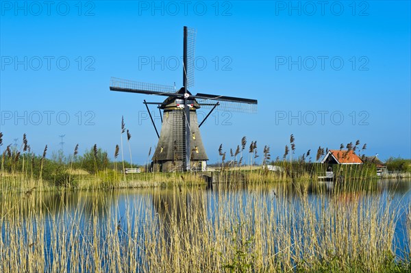 Dutch windmill over a canal