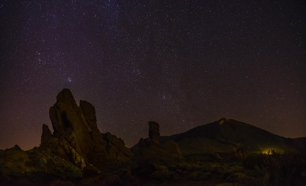 Roque Cinchado and Teide vulcano with starry sky