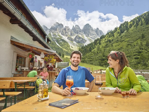 Hikers taking break at mountain hut