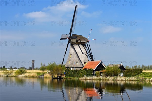Dutch windmill over a canal