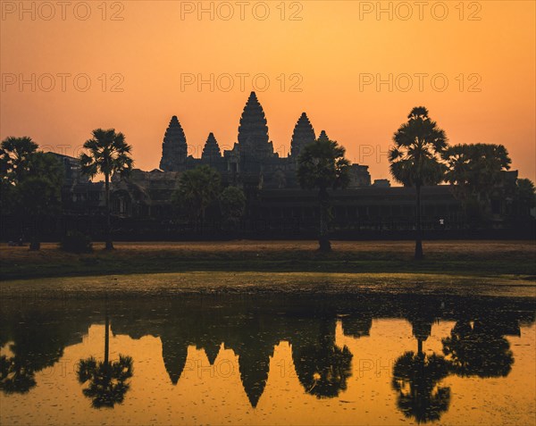 Temple complex of Angkor Wat reflected in the water basin