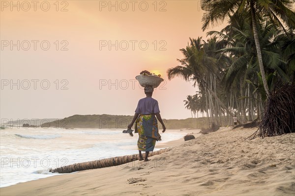 Local woman carrying goods on her head
