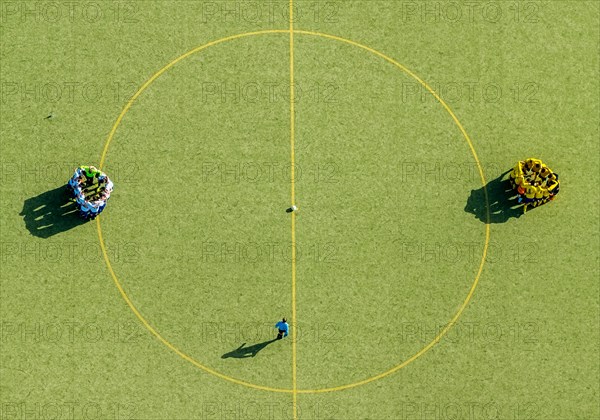 Football players at the center circle