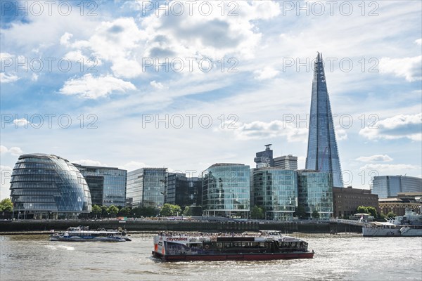 View over the Thames on More London Riverside with City Hall and skyscraper The Shard