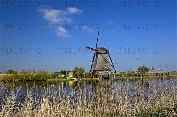 Dutch windmill over a canal