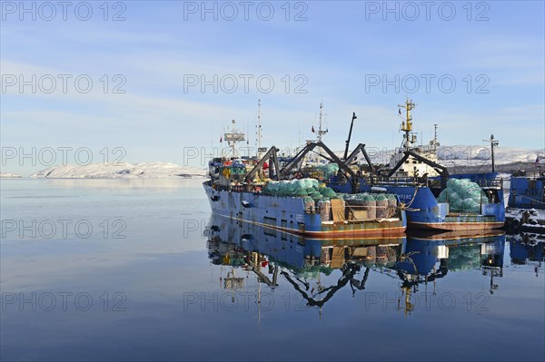 Rusty Russian fishing boats in harbor