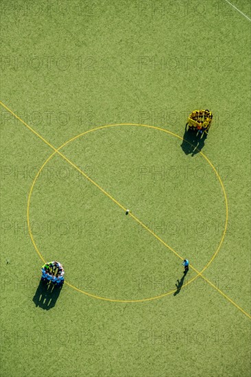 Football players at the center circle