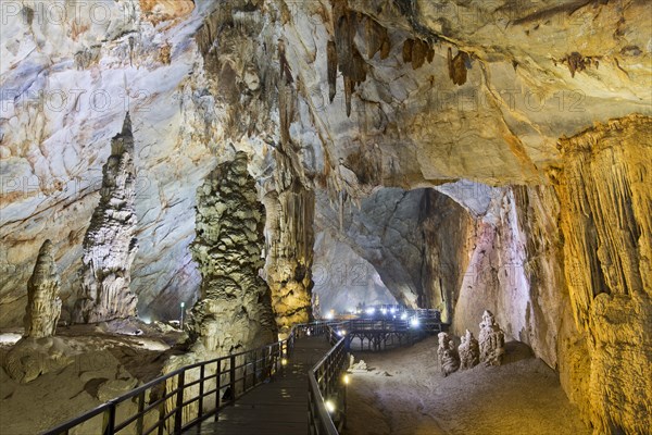 Boardwalk through illuminated dripstone cave