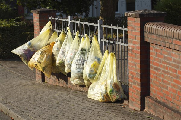 Yellow bags with plastic waste
