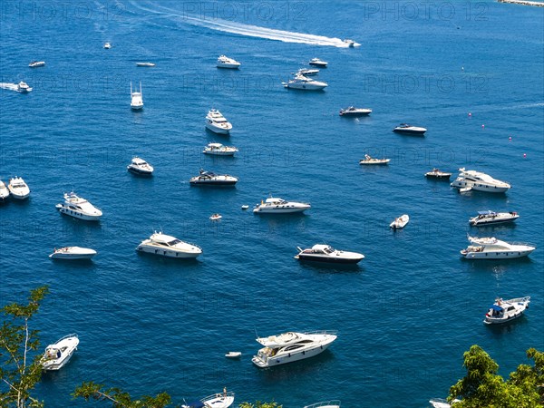Motorboats anchor in the bay of Lacco Ameno