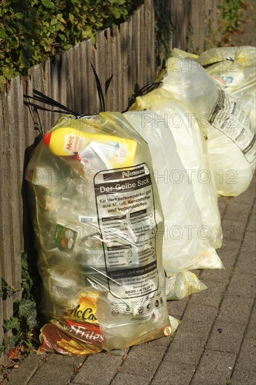 Yellow bags with plastic waste
