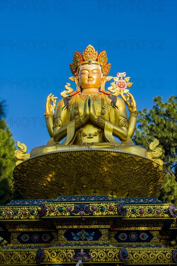 Big golden statue of Maitreya Buddha at back of Swayambhunath temple