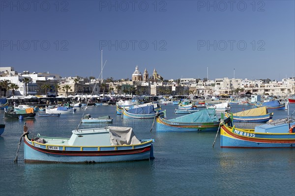Cityscape with colorful fishing boats