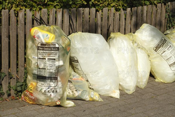 Yellow bags with plastic waste