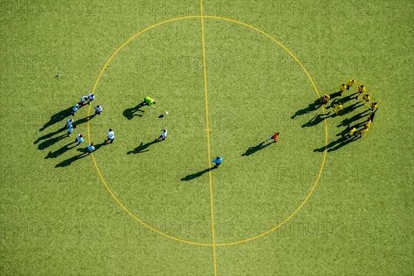 Football players at the center circle
