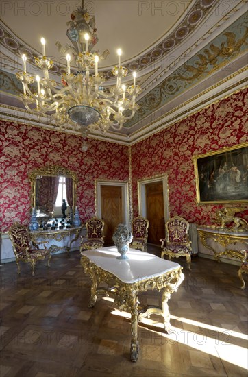 Hall with historical furniture and chandeliers