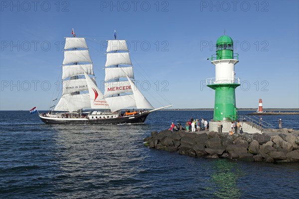 Lighthouse with sailing boat Mercedes at back