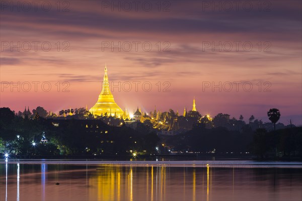 Illuminated Shwedagon Pagoda at sunset