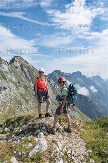 Two female hikers on trail