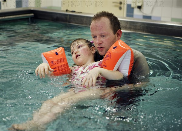 Physiotherapist during rehabilitation in the kinetotherapeutic bath