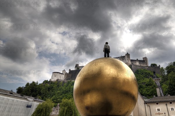 Man on a golden ball