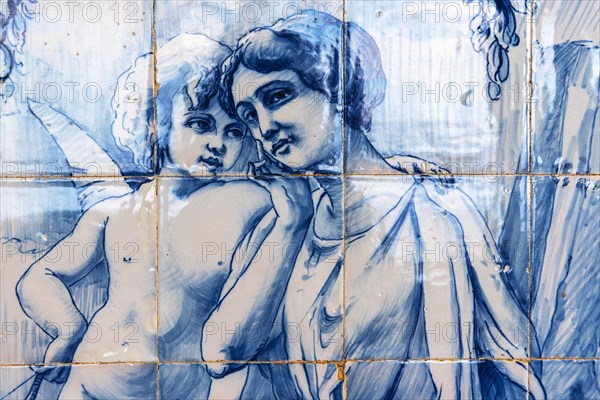 Angel embracing a young woman