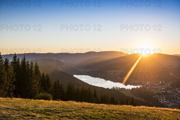 View from Hochfirst to Lake Titisee and Feldberg mountain at sunset