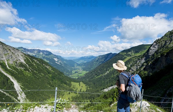 Hiker on the hiking trail from Hinterstein to Schrecksee