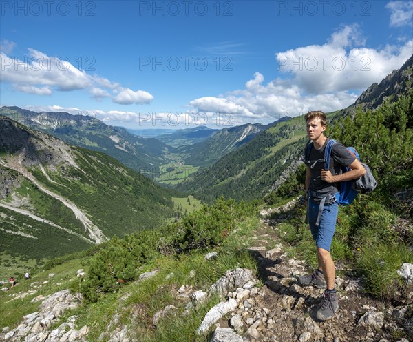 Hiker on the hiking trail from Hinterstein to Schrecksee