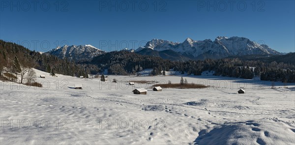 Frozen Lake Geroldsee in winter in front of Karwendel Mountains