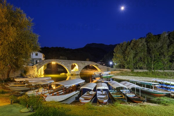 Excursion boats and Old Bridge Stari most at dusk
