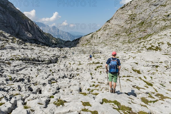 Hiker crosses rocks