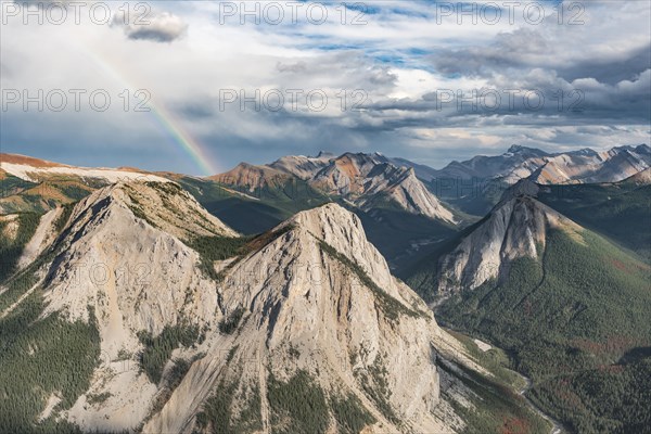 Panoramic view on mountain landscape with rainbow