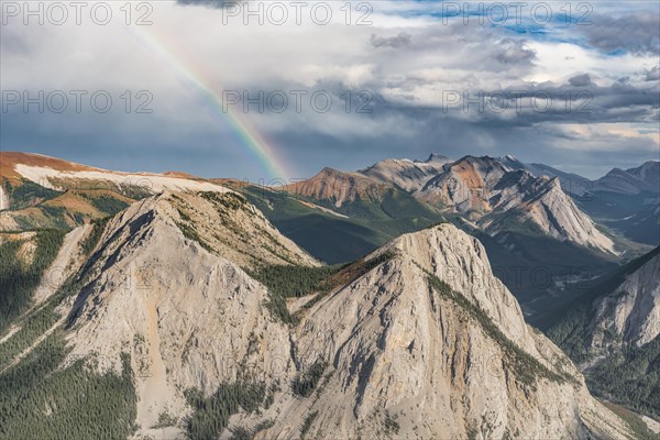 Panoramic view on mountain landscape with rainbow